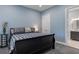 Comfortable bedroom with a queen bed, bedside table, and view into a bathroom at 1130 Plantation Overlook Dr, Moncks Corner, SC 29461