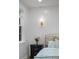 Stylish bedroom features neutral decor, a decorative headboard, a bedside table with flowers, and natural light at 1130 Plantation Overlook Dr, Moncks Corner, SC 29461