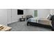 Spacious bedroom with gray carpet, a modern bed, a crib, and a view to the outside at 1130 Plantation Overlook Dr, Moncks Corner, SC 29461