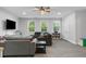Spacious bonus room with ample seating, and lots of light from the windows at 1130 Plantation Overlook Dr, Moncks Corner, SC 29461