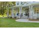Inviting porch featuring stone columns, classic railings, and a welcoming entryway with a double door entrance at 1130 Plantation Overlook Dr, Moncks Corner, SC 29461