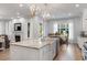 Open-concept kitchen featuring a large island, a dining area, and seamlessly connected living spaces at 1130 Plantation Overlook Dr, Moncks Corner, SC 29461