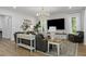Bright living room features a large sectional sofa, stylish decor, and ample natural light at 1130 Plantation Overlook Dr, Moncks Corner, SC 29461