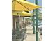 Cozy outdoor seating area with yellow umbrellas, inviting guests to relax and enjoy the surroundings at 1130 Plantation Overlook Dr, Moncks Corner, SC 29461