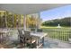 Enjoy peaceful views of the green lawn and fountain from this breezy screened porch at 1130 Plantation Overlook Dr, Moncks Corner, SC 29461