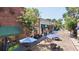 Picturesque street view featuring outdoor seating under blue umbrellas and historic brick buildings at 1130 Plantation Overlook Dr, Moncks Corner, SC 29461