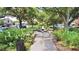 Picturesque walking path with lush greenery, a decorative fountain, and benches inviting you to stroll and unwind at 1130 Plantation Overlook Dr, Moncks Corner, SC 29461