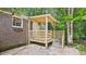A wooden back porch extends off the home's brick facade at 1225 Dennis Blvd, Moncks Corner, SC 29461