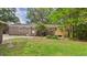A brick house with a well-maintained backyard offers a tranquil outdoor space at 1225 Dennis Blvd, Moncks Corner, SC 29461
