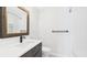 The bathroom has a decorative mirror, a bath tub, and a tiled shower at 1225 Dennis Blvd, Moncks Corner, SC 29461