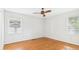 This bedroom provides natural light and ample space with hardwood flooring at 1225 Dennis Blvd, Moncks Corner, SC 29461