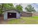 Detached garage, offering ample space for parking and storage, complementing the brick home at 1225 Dennis Blvd, Moncks Corner, SC 29461