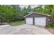 This detached two-car garage is made of red brick with white garage doors at 1225 Dennis Blvd, Moncks Corner, SC 29461
