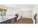 Updated kitchen featuring a stainless steel dishwasher, white cabinets, and a charming breakfast nook at 1225 Dennis Blvd, Moncks Corner, SC 29461