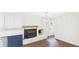 Kitchen featuring a white-painted brick fireplace and eat-in breakfast nook with stylish light fixture at 1225 Dennis Blvd, Moncks Corner, SC 29461