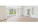 Bright living room with a bay window, built-in shelving, and light wood-look floors at 1225 Dennis Blvd, Moncks Corner, SC 29461