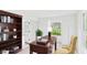 Office with a wooden desk, shelving, and ample natural light from the window at 1225 Dennis Blvd, Moncks Corner, SC 29461