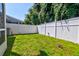Spacious fenced backyard with lush green grass, offering privacy and ample space for outdoor activities at 143 Dorothy Dr, Charleston, SC 29414
