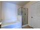 Bright bathroom featuring a soaking tub, walk-in shower, and tiled floors at 143 Dorothy Dr, Charleston, SC 29414