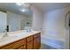 A full bathroom with double vanity, soaking tub, and a glass walk-in shower at 143 Dorothy Dr, Charleston, SC 29414