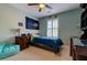 Cozy bedroom features a ceiling fan, natural light, and tasteful decor, creating a comfortable personal space at 143 Dorothy Dr, Charleston, SC 29414