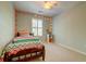 Bright bedroom features string lights, neutral walls, carpet and a bed with colorful zigzag patterned bedding at 143 Dorothy Dr, Charleston, SC 29414