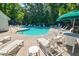 Inviting community pool surrounded by lounge chairs, offering a refreshing oasis for residents to relax and socialize at 143 Dorothy Dr, Charleston, SC 29414
