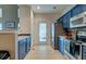 Bright kitchen featuring painted cabinetry, stainless appliances, and tile flooring at 143 Dorothy Dr, Charleston, SC 29414