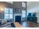 Bright living room featuring a fireplace, tall ceilings, and hardwood floors at 143 Dorothy Dr, Charleston, SC 29414