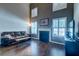 Bright living room featuring a fireplace, tall ceilings, and hardwood floors at 143 Dorothy Dr, Charleston, SC 29414