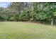 This grassy backyard features a classic wooden fence, creating a private outdoor space at 1436 Lagoon Park Cir, Mount Pleasant, SC 29466