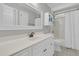 A bathroom features white cabinets, a large mirror, and a shower-tub combo at 1436 Lagoon Park Cir, Mount Pleasant, SC 29466