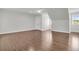 An upstairs bedroom features wood floors, a ceiling fan, and a dormer window at 1436 Lagoon Park Cir, Mount Pleasant, SC 29466