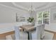 Dining room features elegant light fixture and trim with large backyard view at 1436 Lagoon Park Cir, Mount Pleasant, SC 29466