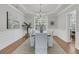 Formal dining room featuring wainscoting, a modern light fixture, and seating for six at 1436 Lagoon Park Cir, Mount Pleasant, SC 29466