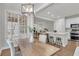 Open floorplan showcasing a dining room with a modern light fixture and adjoining kitchen at 1436 Lagoon Park Cir, Mount Pleasant, SC 29466