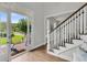 Welcoming entryway with an open door, staircase, and hardwood floors at 1436 Lagoon Park Cir, Mount Pleasant, SC 29466