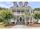 Charming two-story home with a double porch, lush landscaping and a welcoming entrance at 1436 Lagoon Park Cir, Mount Pleasant, SC 29466