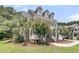 This lovely home features a classic porch and mature landscaping at 1436 Lagoon Park Cir, Mount Pleasant, SC 29466