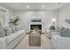 Bright living room featuring a fireplace, comfortable seating, and neutral tones at 1436 Lagoon Park Cir, Mount Pleasant, SC 29466