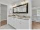 Spacious bathroom with dual sinks, granite countertops, framed mirror, and easy access to bedroom and linen closet at 1436 Lagoon Park Cir, Mount Pleasant, SC 29466
