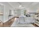 Serene main bedroom features hardwood floors, tray ceilings, and French door access to the exterior, enhancing natural light at 1436 Lagoon Park Cir, Mount Pleasant, SC 29466