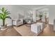 Relaxing sitting room with comfortable seating, area rug, and a view into the dining room at 1436 Lagoon Park Cir, Mount Pleasant, SC 29466