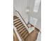 Elegant staircase with wooden steps and white banister leading to a bright entryway with front door and transom windows at 1436 Lagoon Park Cir, Mount Pleasant, SC 29466