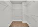 Practical walk-in closet with wire shelving and hardwood floors offering ample storage in a well-organized space at 1436 Lagoon Park Cir, Mount Pleasant, SC 29466