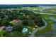 Waterfront home with pool and dock surrounded by luscious green trees at 1468 N Relyea Ave, Charleston, SC 29412