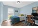 Cozy bedroom features natural light, a comfortable bed, and a functional workspace for productivity at 1468 N Relyea Ave, Charleston, SC 29412