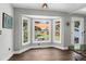 Bright breakfast nook with views of the backyard through large bay windows at 1468 N Relyea Ave, Charleston, SC 29412