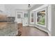 Charming breakfast nook with granite countertops, large windows, and backyard views at 1468 N Relyea Ave, Charleston, SC 29412