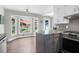 Bright breakfast nook with backyard views, granite countertops, and stainless steel appliances at 1468 N Relyea Ave, Charleston, SC 29412